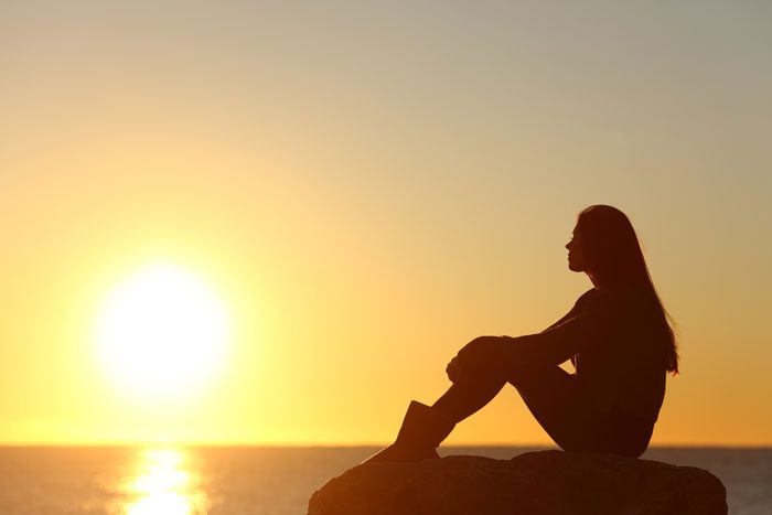 life after treatment - victory addiction recovery center - woman watching sunset