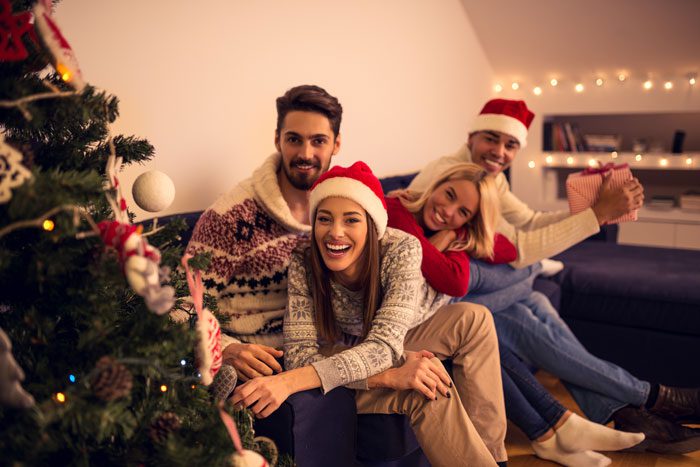 10 tips for staying sober at holiday parties - friends at holiday party - victory addiction recovery center