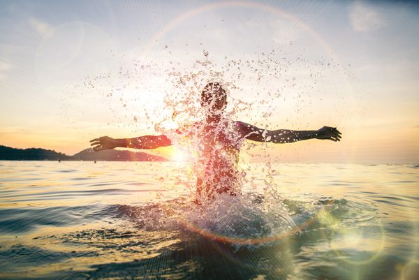 fun activities for sober people - man surfing at sunset - victory addiction recovery center
